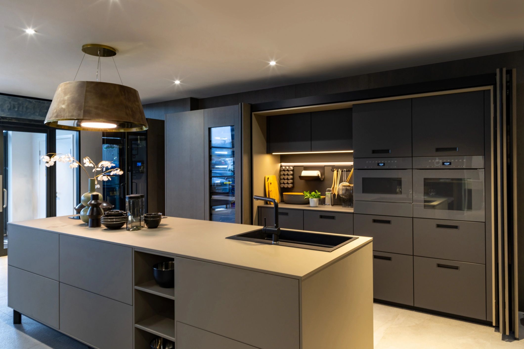 Contemporary dark wood kitchen with marble island and modern luxury details