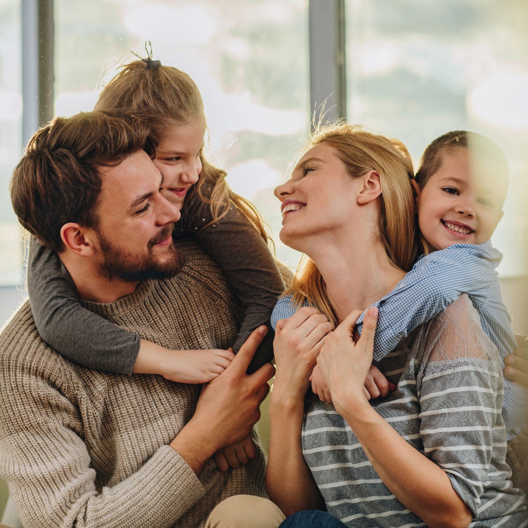 Young loving family communicating while spending time together.