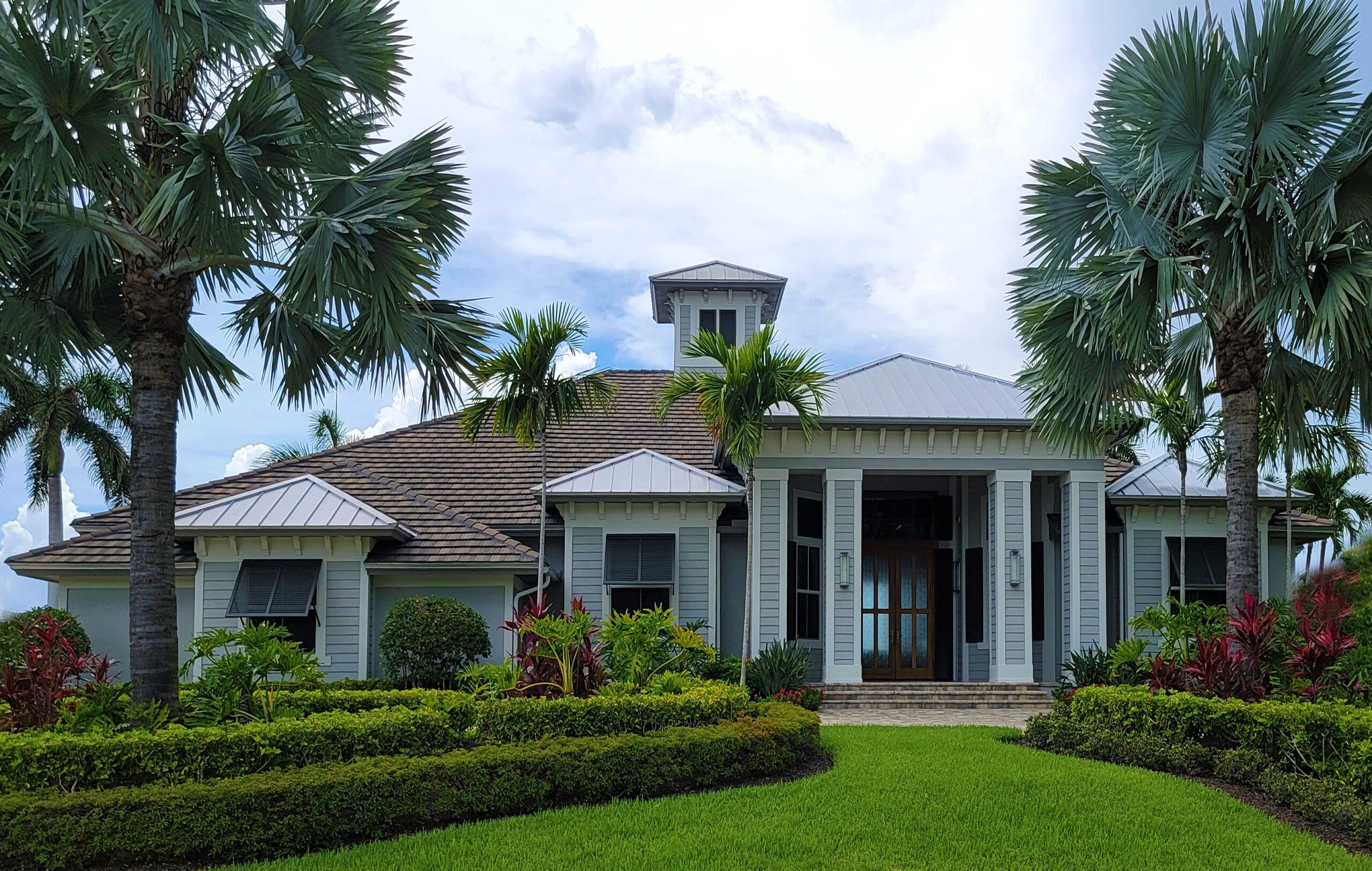 Florida waterfront-style home with sunny exterior